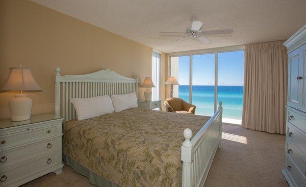 Queen size bed at Long Beach Resort in Panama City Beach, Florida.