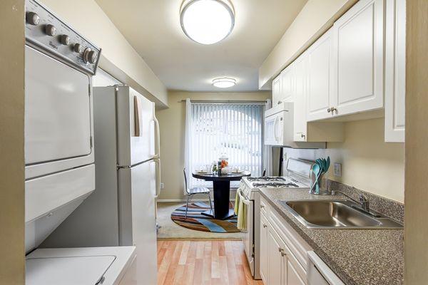 Classic white kitchens with washer/dryer.