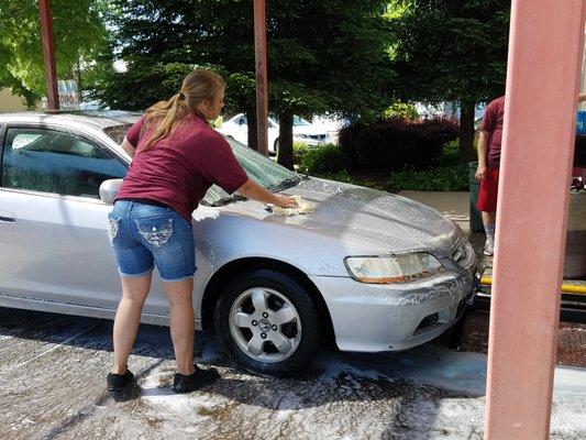 Washing Car before entering the bay.