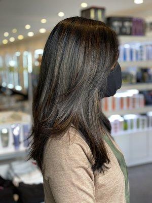 A beautiful brunette with subtle highlights and a haircut to give movement. By Stacie and Sukie