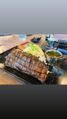 Skirt. Steak with jasmine rice and chimichurri sauce, plantains.