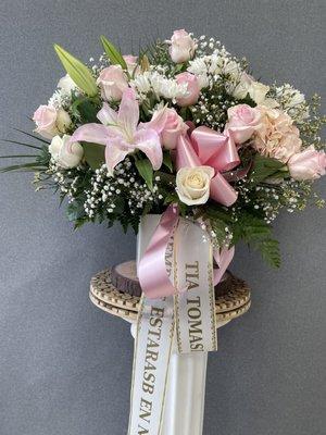 Flowers for a funeral, customized with yellow and pink.