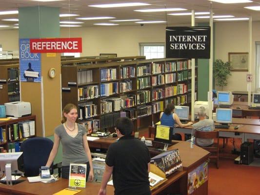 Looking across to the reference desk. Sonora Miller and Maira Diaz are our reference librarians, welcoming questions.