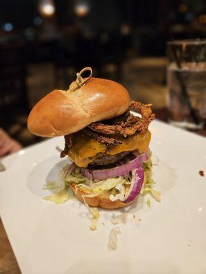 Burger with fried onion strings added.