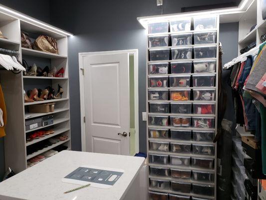 A Shoe Collector's walk in closet in special color with LED Lighting and storage for a lot of shoes.