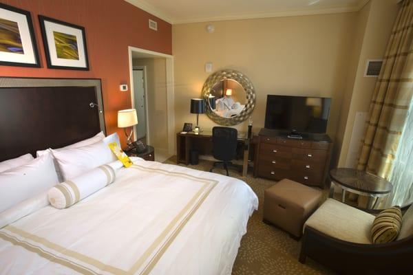 The One-Bedroom Suite offers a King-Sized luxury bed with a separate living area with two flat-screen TVs and WiFi access.