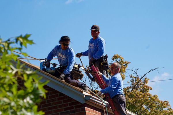 The Nest team in action building a custom standing seam metal roof in Falls Church, VA!