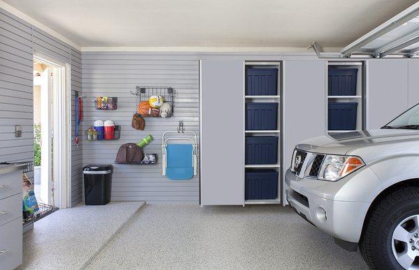 Silver Garage Cabinets with sliding doors and slatwall.