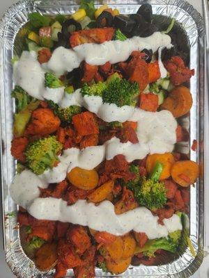 Amazing chicken over rice with broccoli and carrots