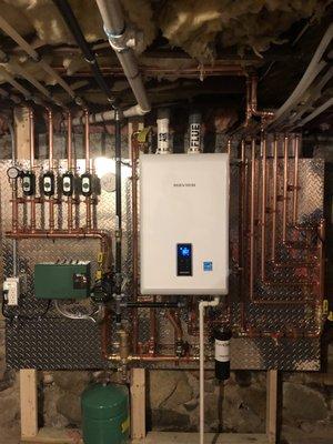 this unit is 95% efficient and provides heat and hot water . These customers got a $2,400 rebate from mass save and monthly energy savings!