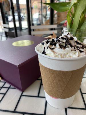 Hot chocolate with a box's of macaroons