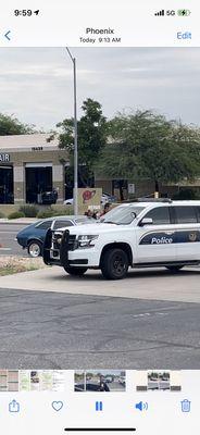 Police showing up as Tom Blackwell was pushing my car into 40th street