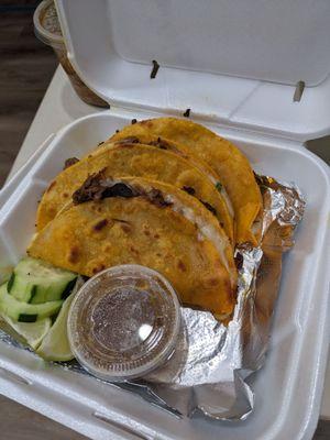 Quesa birria tacos with a side of broth that the meat was cooked in!