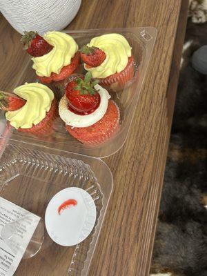 Strawberry lemon cupcakes and one strawberry cheesecake cupcake.