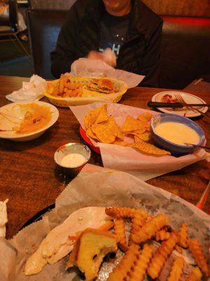 Chips and queso  and bacon wrapped tots.   Chicken sandwich and club sandwich.