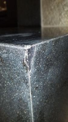 Check out these glued back on chipped pieces on my fireplace!