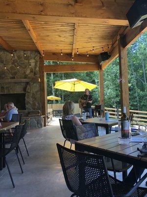 Lloyd singing and the outdoor patio area