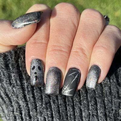 Love my Halloween nails by Thomas. The detail and his artistic abilities are amazing. Love the silver cateye polish and matte combination.