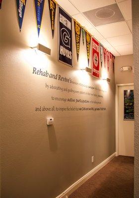 The front hallway with our Mission Statement on the wall. "We CAN and we WILL, get better TOGETHER."