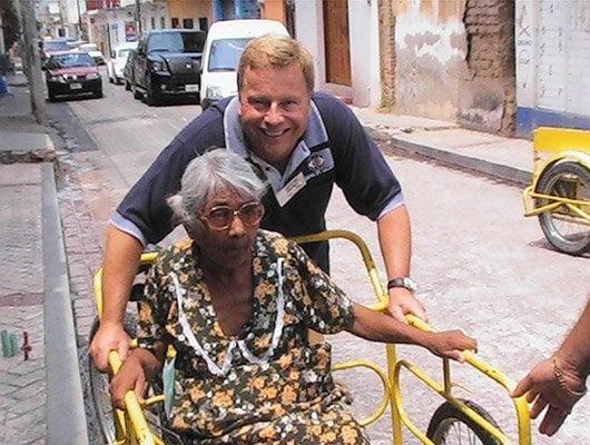 Another happy patient and new friend on one of Dr. Frank's Volunteer Trips to  Third World Countries.