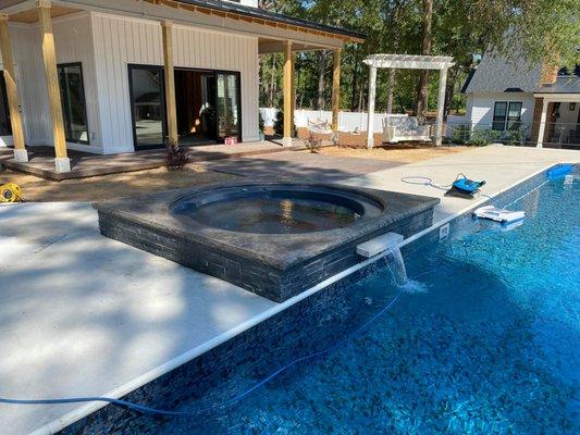 Pool Spa remodel with concrete and stone