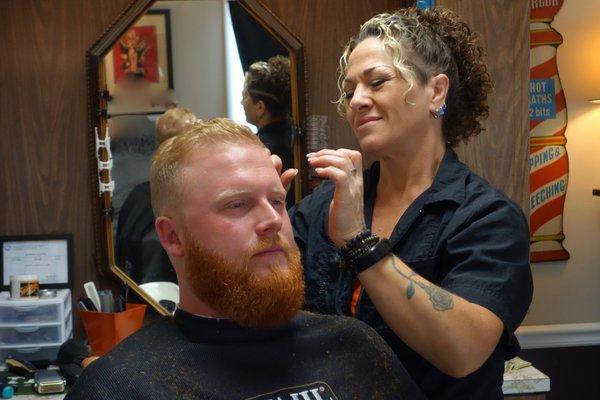 Fresh haircut and beard shaping from Marny the Barber.