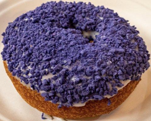 Purple crunchy donut. Has a hint of coconut. Texturally satisfying. Pretty to look at!