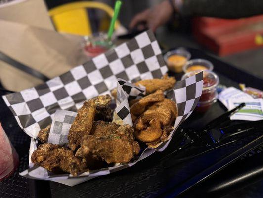 Lemon pepper and Cajun dry rub with wedges and a fried pickle