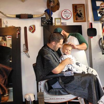 Titus getting his first haircut by Aaron!