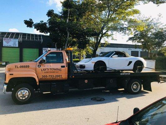 Towing car to shop for repairs.