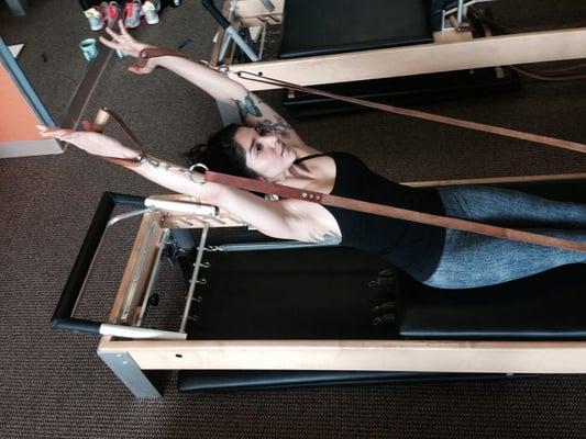 Nicole doing back rowing on the reformer