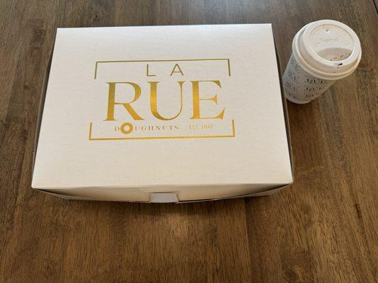 La Rue pastry box with a Black Forest latte