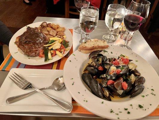 Ranchers reserve rib eye steak and mussels with white wine sauce