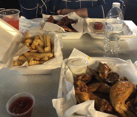 Reba's wings w fries, $1 kool aid and $2 water.