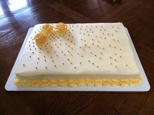 Half-sheet cake made by Gail to my design - three gold roses with gold candies streaming across the cake.  The best cream cheese frosting!