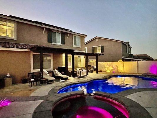 Our Saltwater Pool and Spa with Grey Roman Coping, Midnight Blue Pebble with Abalone Shell and Mosaic Grey Tile.