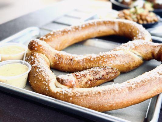 Their signature big pretzel (bread) with cheese (comes with 3 flavors of dipping sauces). This is a must try!