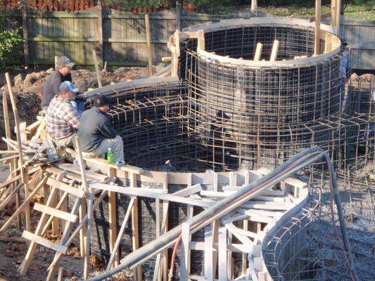 We build everything in house.  We tie our steel, make our forms, do the excavation.  Shot our gunite.