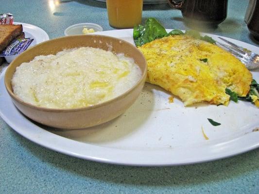 Grits and cheddar and spinach omelet