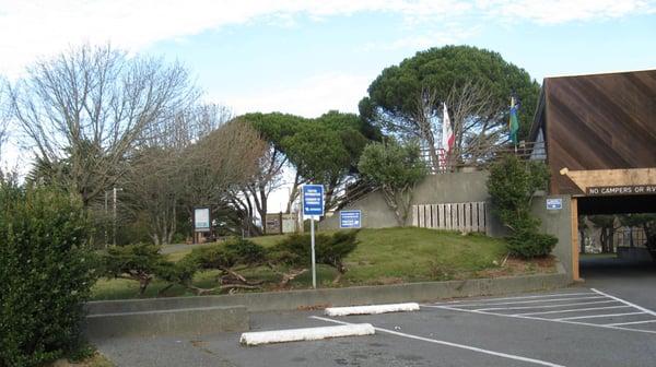 Directional signs in the parking lot.  Go left on the path, then up the hill to the stairs.