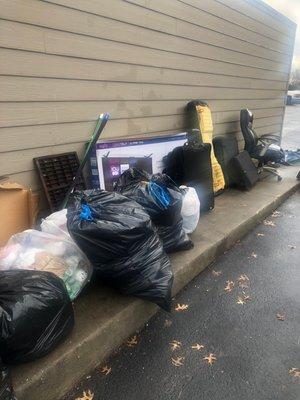 Trash by compactor so you can't walk along sidewalk access