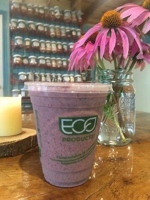 The Oasis Smoothie- Organic Pineapple, Blueberry, Banaba, and Strawberry with Coconut Milk, Seasonal Greens, and Hemp Hearts.