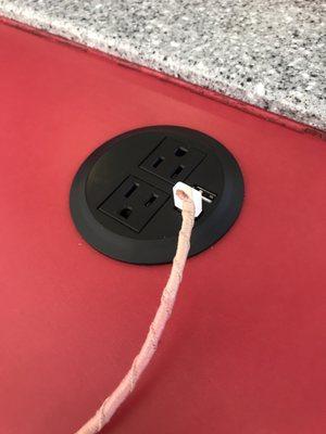 Outlets and USB ports to juice up your electronics while you wait.