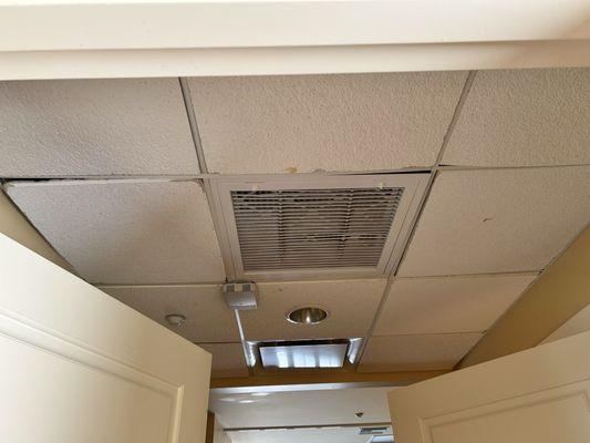 Dusty air vent  Leaky ceiling tiles