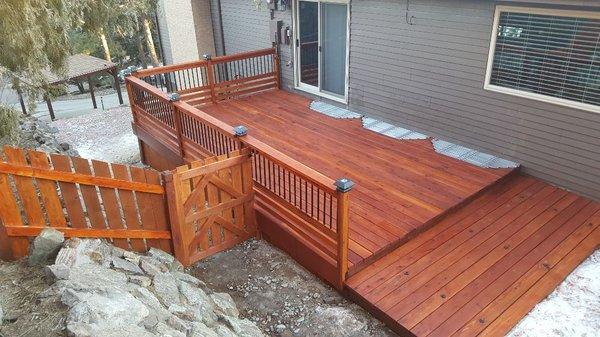 Deck project-university park : redwood deck, custom railing, low volt/solar lighting, screwless fastening system, Cabots stain