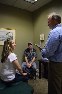 Dr. Ambridge treating patients in one of our treatment rooms