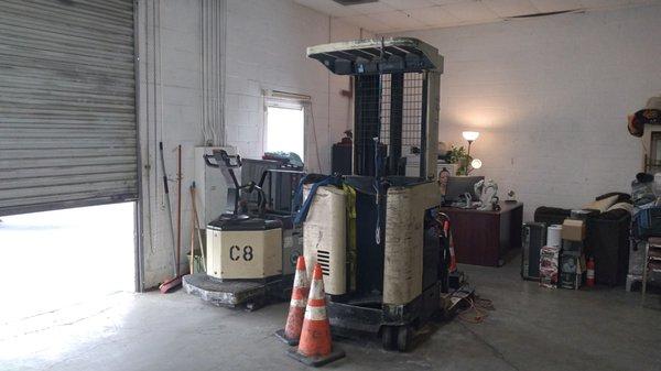 The Pallet Jack and Stand-Up Reach Forklift.