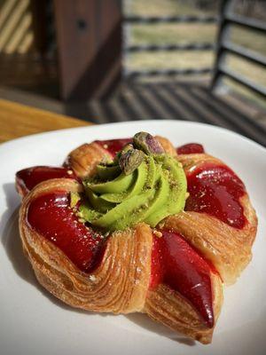 Raspberry & pistachio danish.