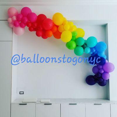 Small organic balloon garland.  Color transition bright rainbow.