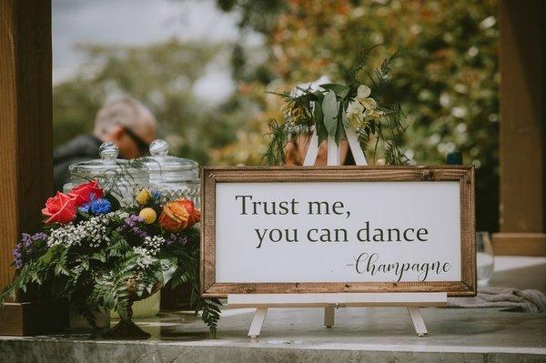 Reception Bar - We adorned sign easels with greenery